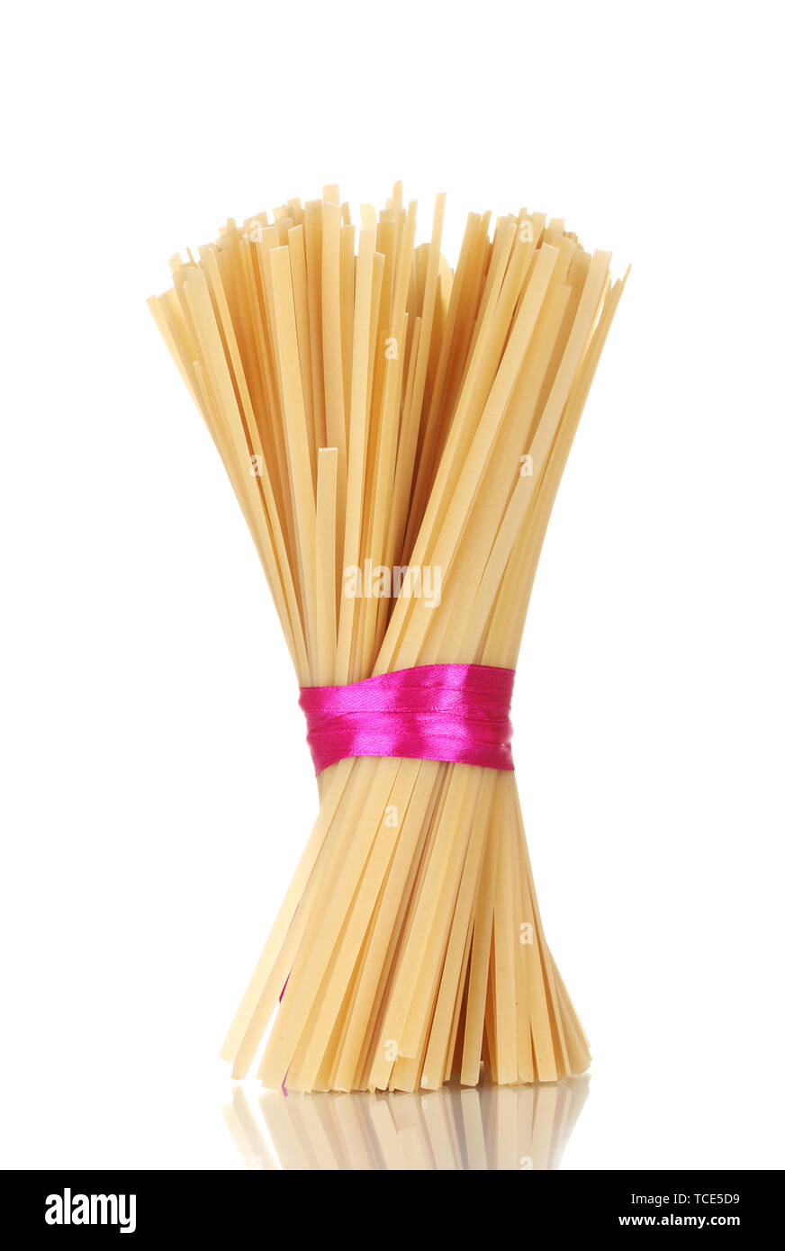 Spaghetti Ribbon Bunch of spaghetti with ribbon isolated on white Stock Photo - Alamy