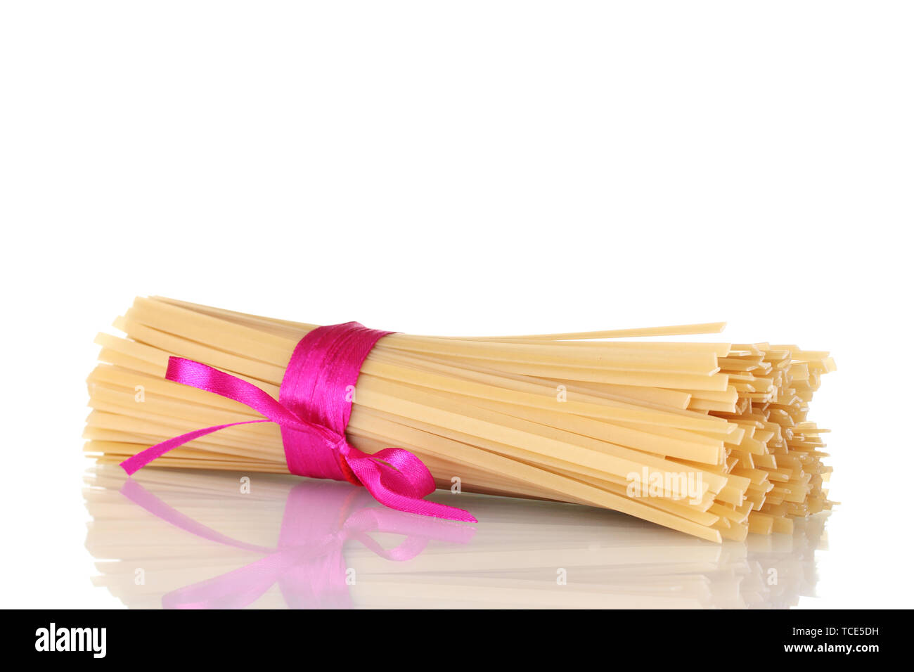 Spaghetti Ruby Ribbons Bunch of spaghetti with ribbon isolated on white Stock Photo - Alamy