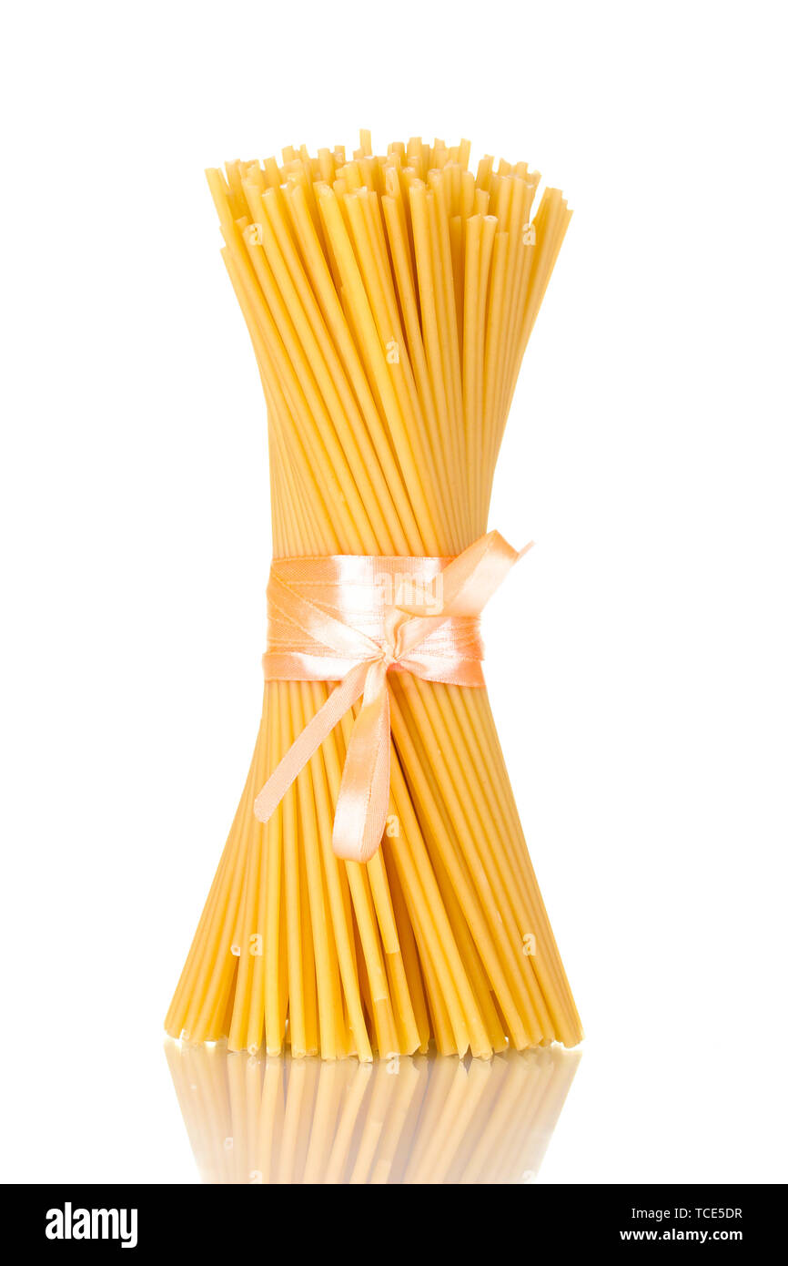 Spaghetti Ribbon Bunch of spaghetti with ribbon isolated on white Stock Photo - Alamy