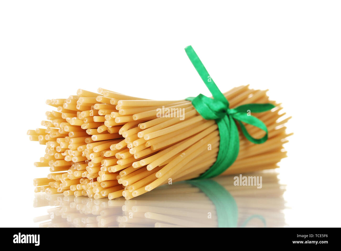 Spaghetti Ribbon Bunch of spaghetti with ribbon isolated on white Stock Photo - Alamy