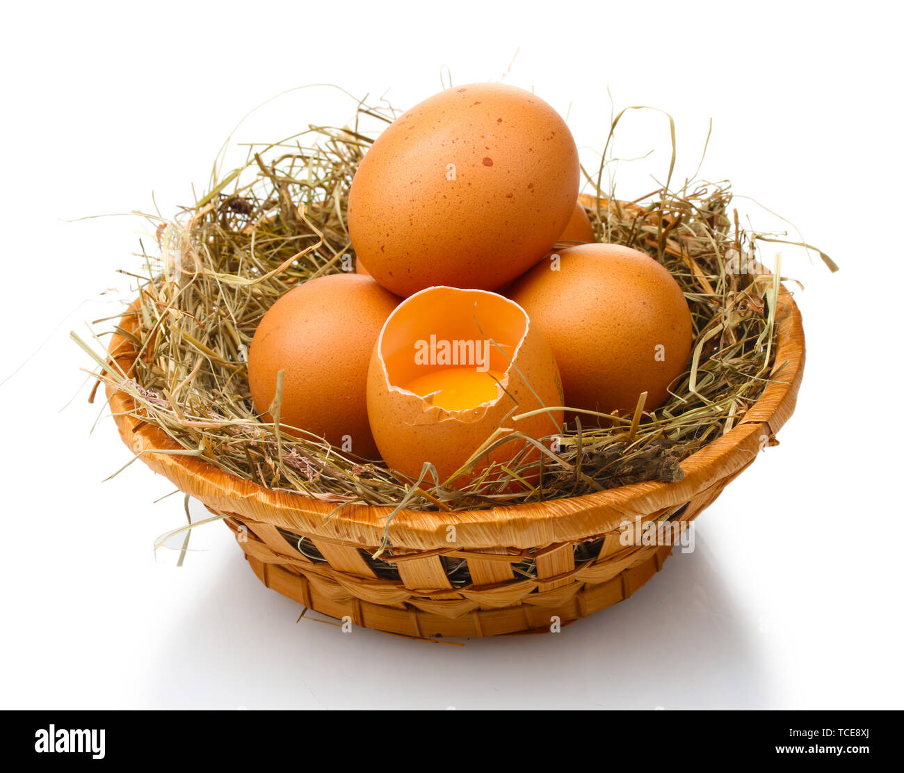 chicken eggs in a nest isolated on white Stock Photo - Alamy