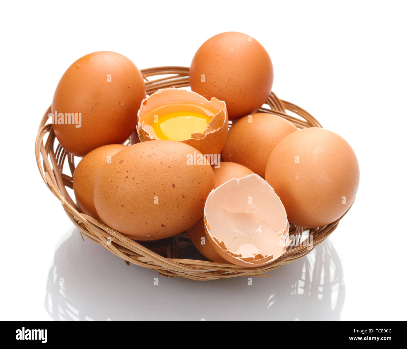chicken eggs in a nest isolated on white Stock Photo - Alamy