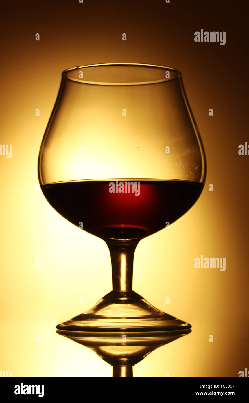 Download Glass Of Cognac On Yellow Background Stock Photo Alamy PSD Mockup Templates