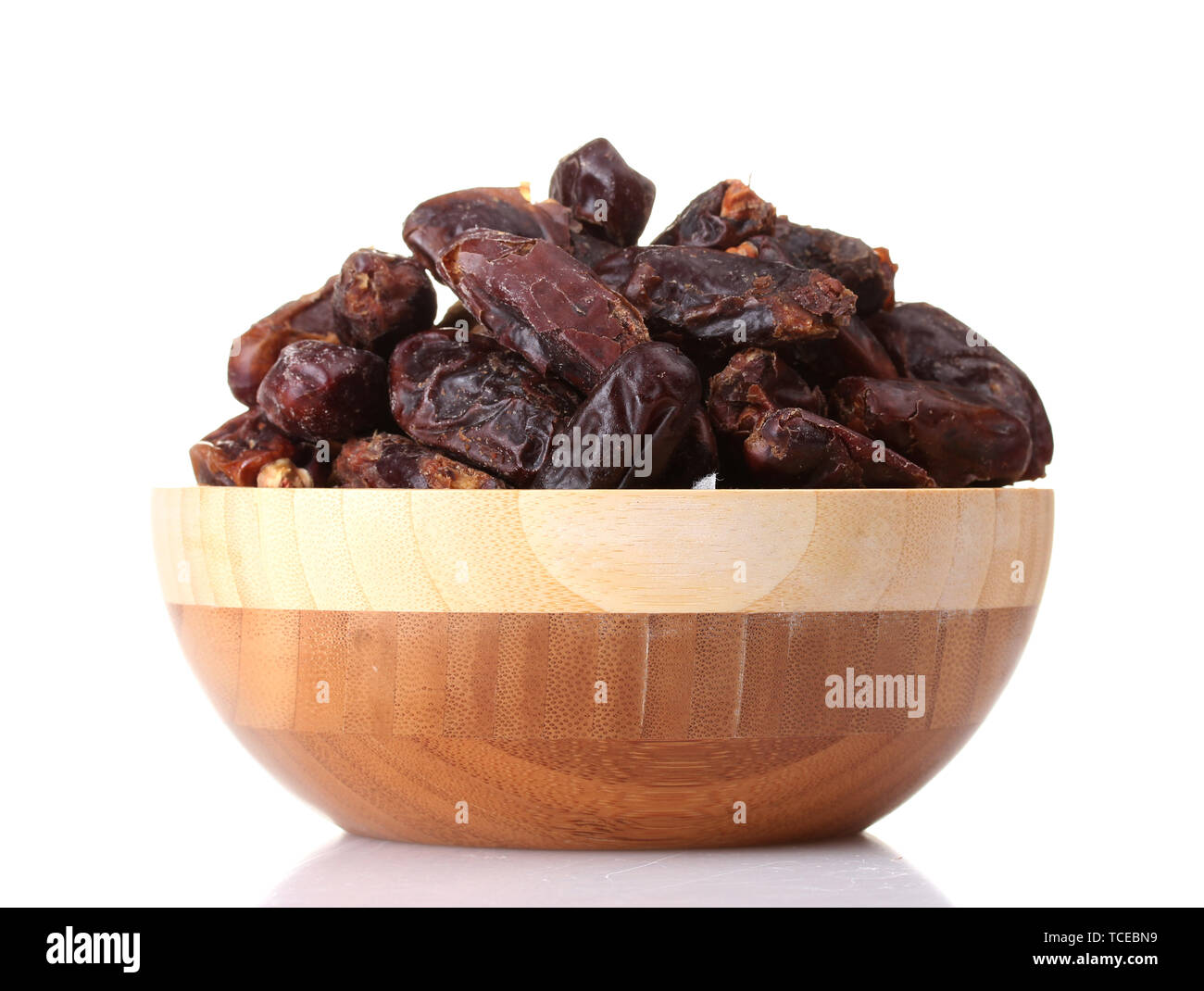 delicious dried dates in wooden bowl isolated on white Stock Photo - Alamy