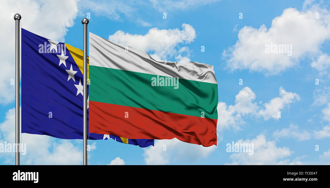 Bosnia Herzegovina and Bulgaria flag waving in the wind against white cloudy blue sky together. Diplomacy concept, international relations. Stock Photo