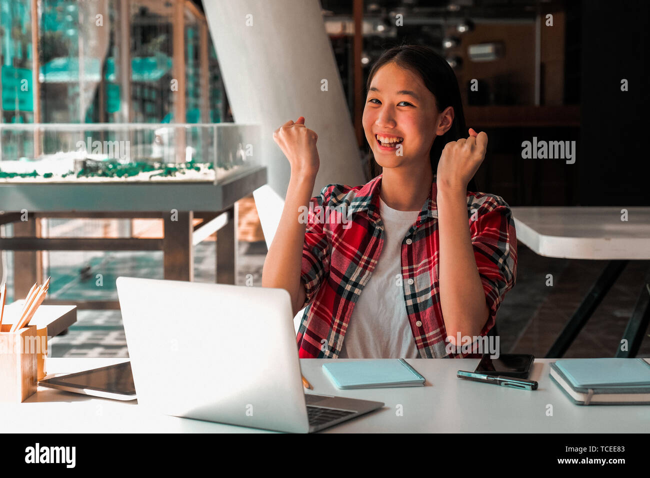 happy asian woman girl teenager raising hands with gladness happiness Stock Photo