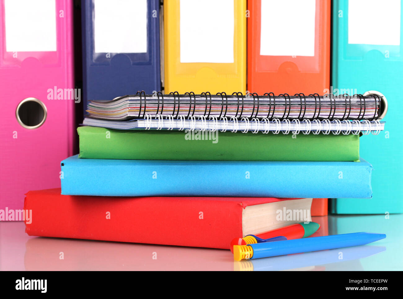 Open Files Stationery Bright office folders and books with stationery close-up isolated on ...