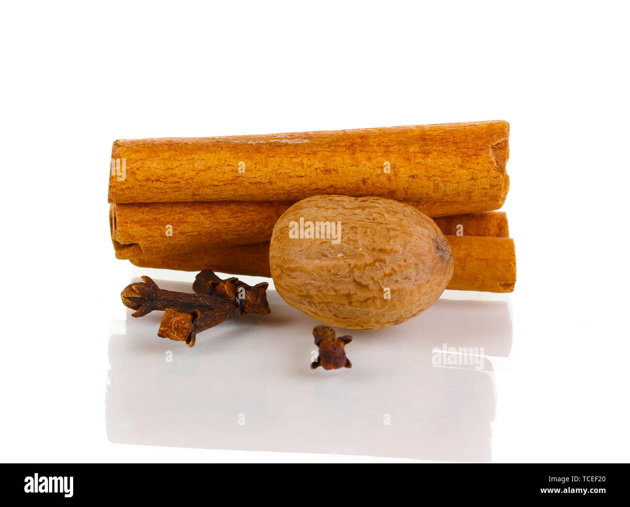 Cinnamon,nutmeg and carnation isolated on white Stock Photo Alamy