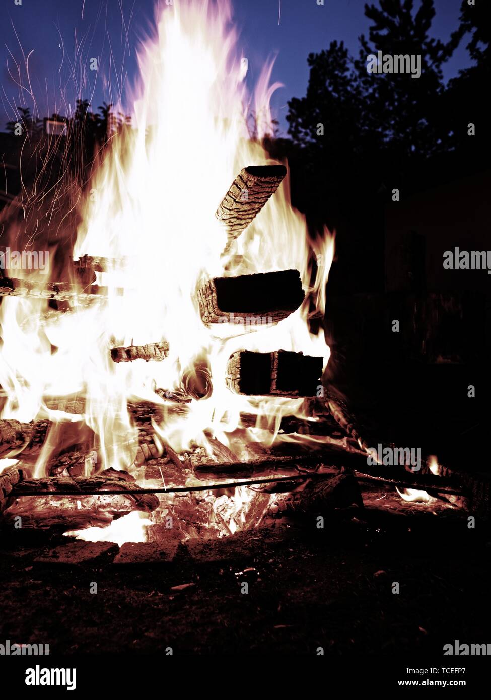 Cleaning old wooden stuff by fire. Close up of big flames fire with red