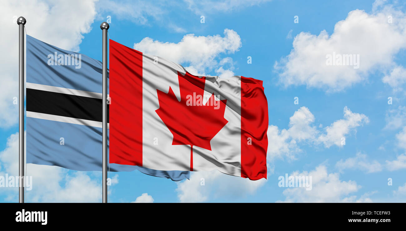 Botswana and Canada flag waving in the wind against white cloudy blue ...