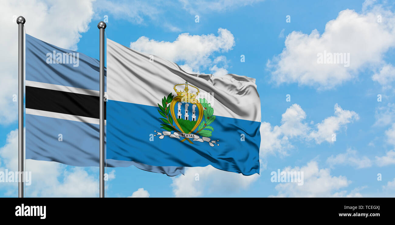 Botswana and San Marino flag waving in the wind against white cloudy ...
