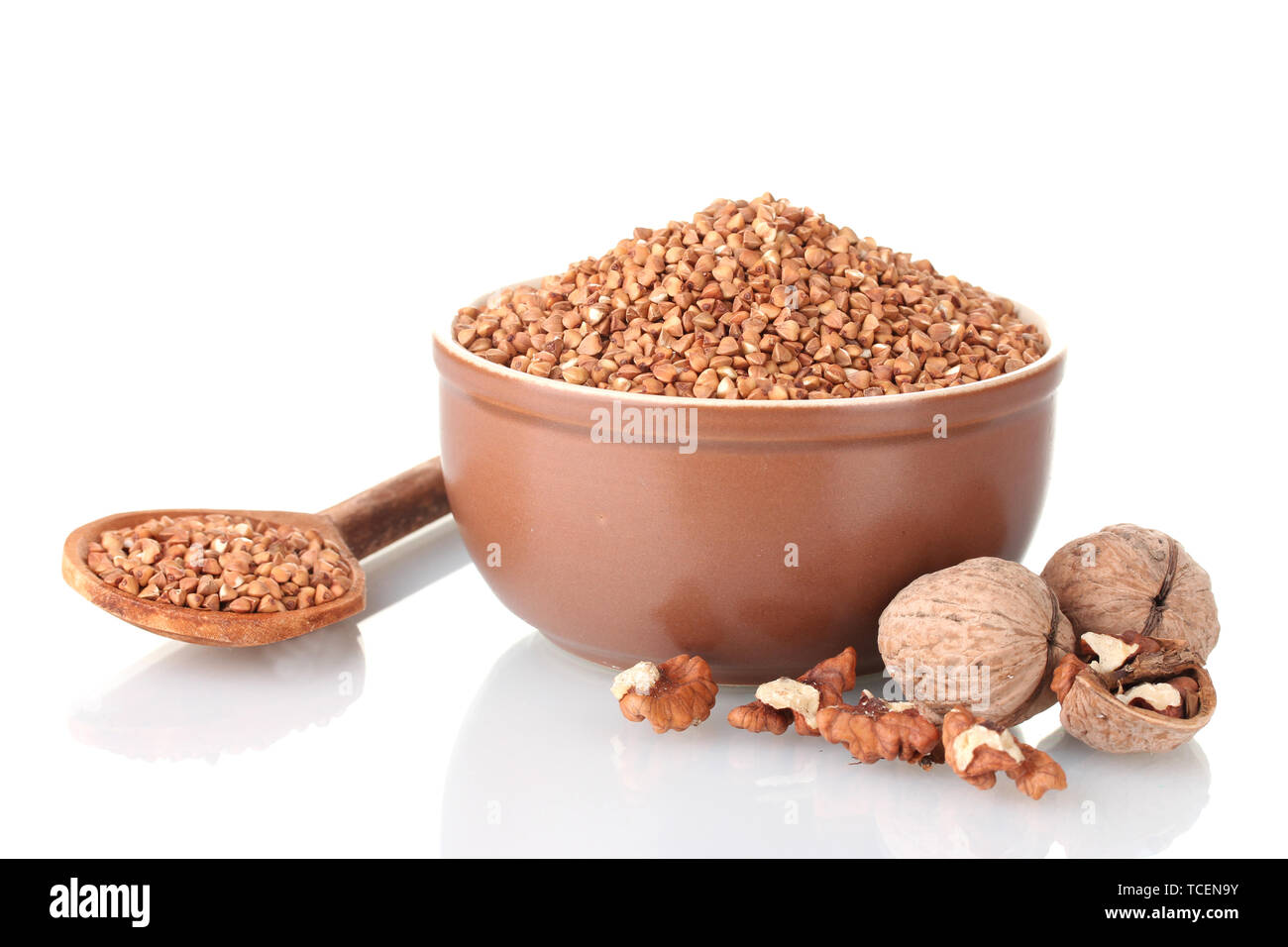 Raw buckwheat with nuts isolated on white Stock Photo Alamy