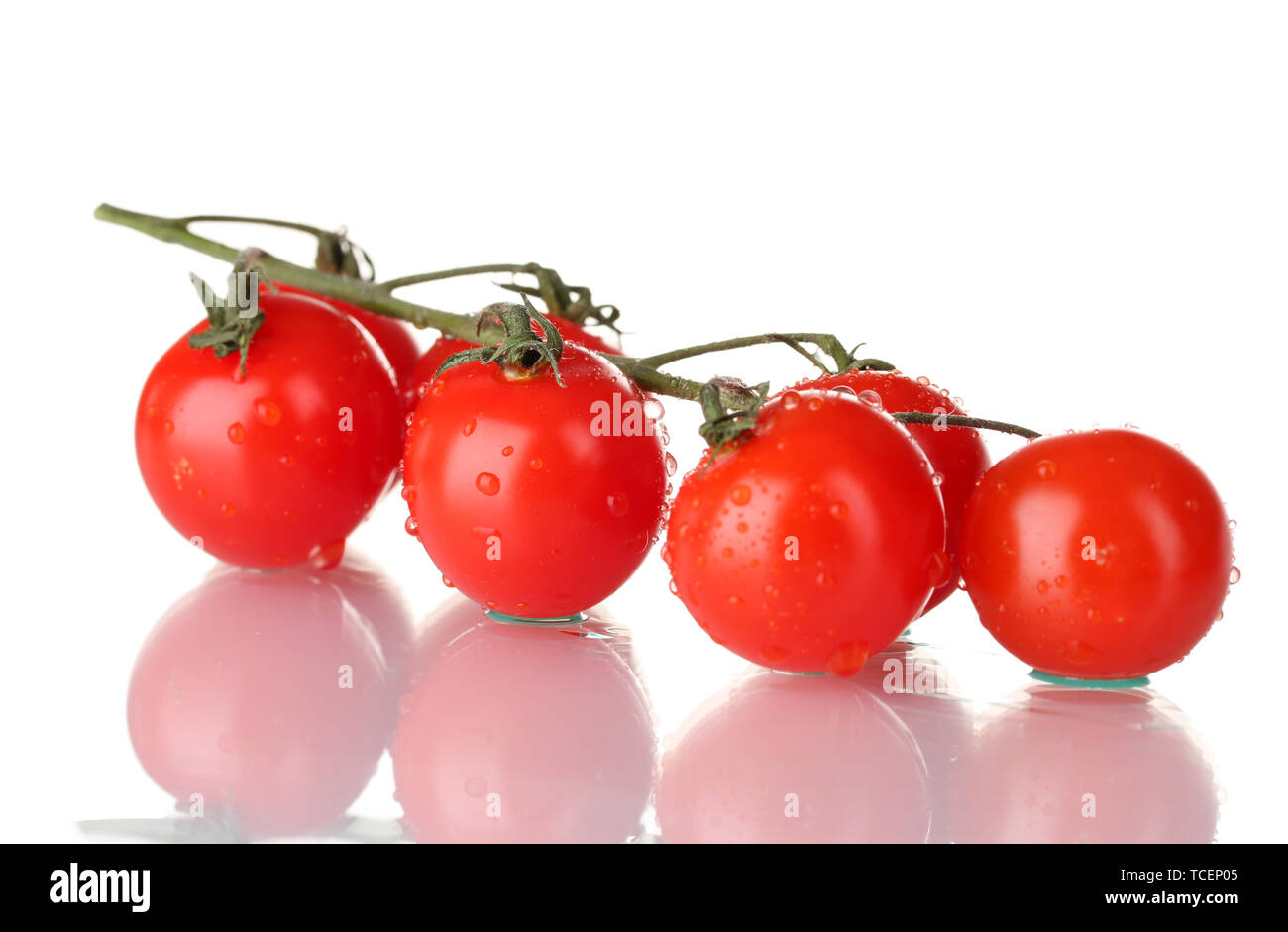 Beautiful cherry tomatoes on a branch isolated on white Stock Photo - Alamy