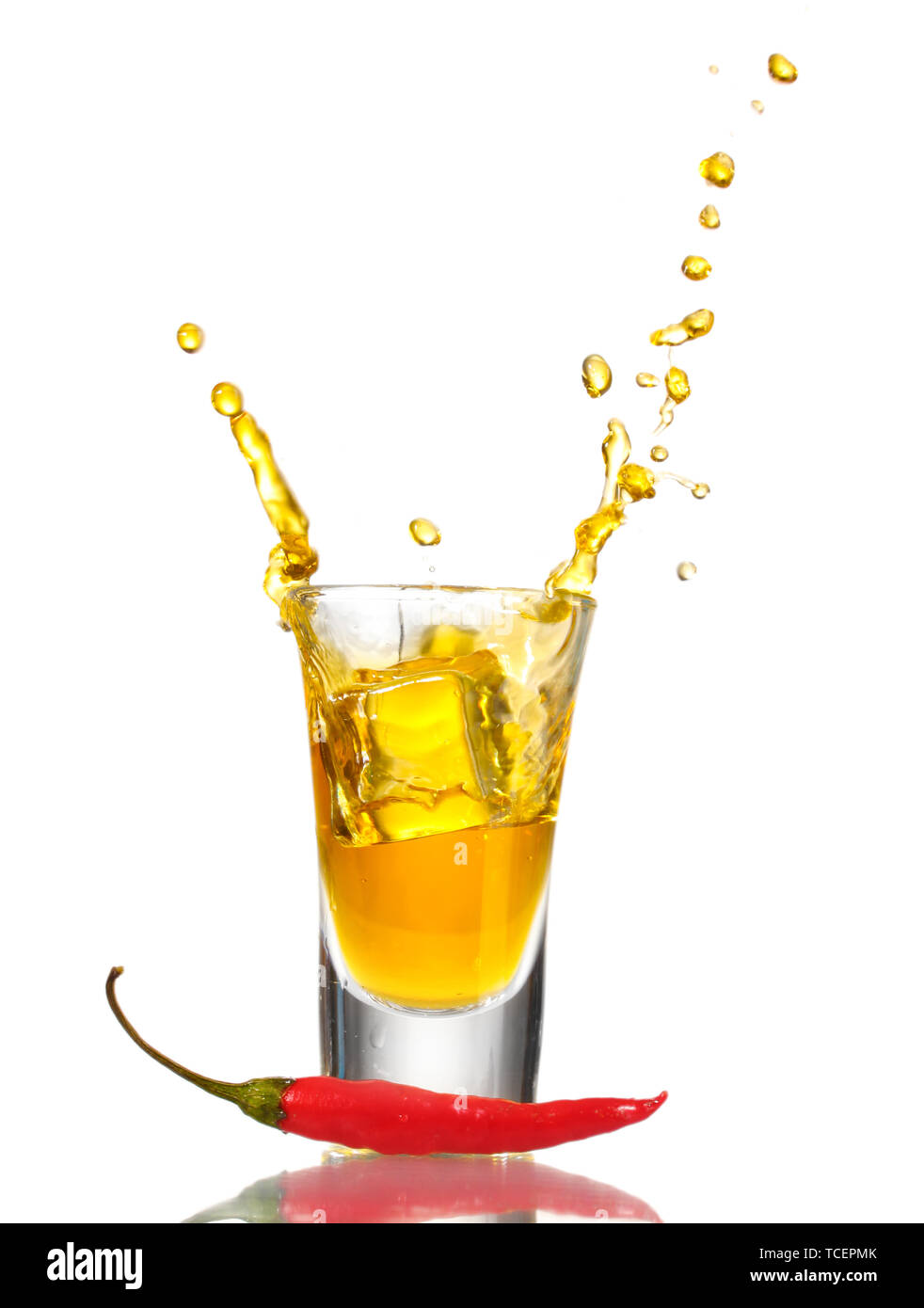 glass of pepper vodka and red chili pepper isolated on white Stock