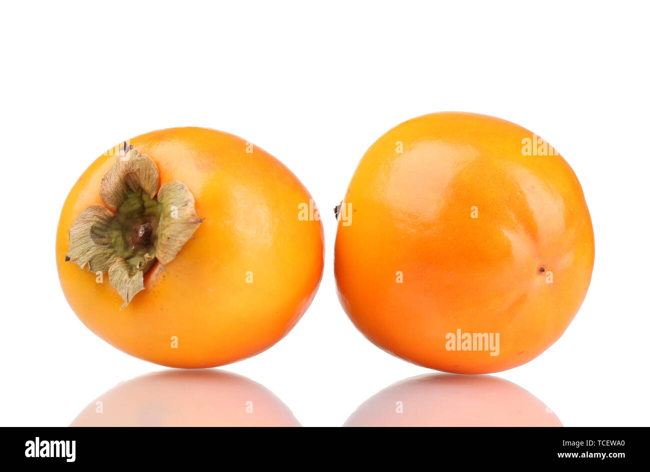 Two appetizing persimmons isolated on white Stock Photo