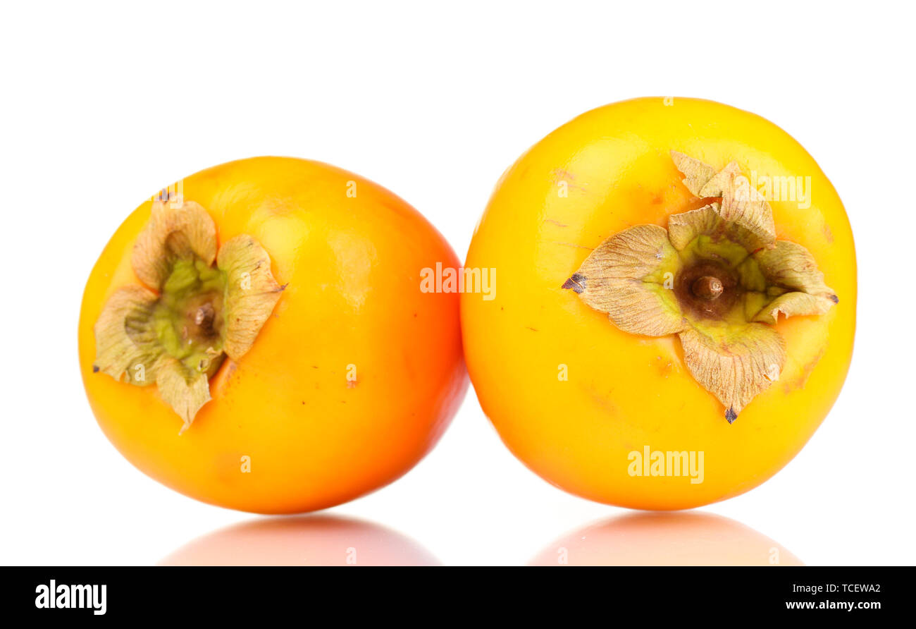 Two appetizing persimmons isolated on white Stock Photo