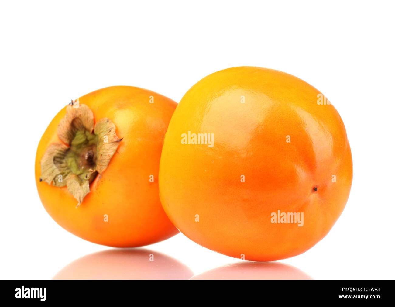 Two appetizing persimmons isolated on white Stock Photo