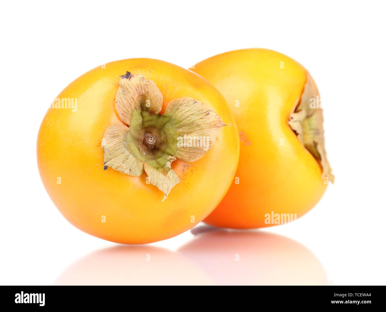 Two appetizing persimmons isolated on white Stock Photo