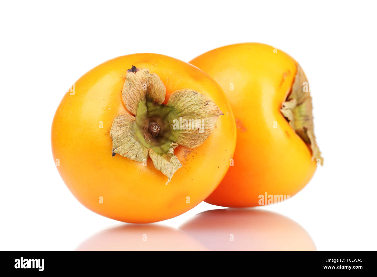 Two appetizing persimmons isolated on white Stock Photo