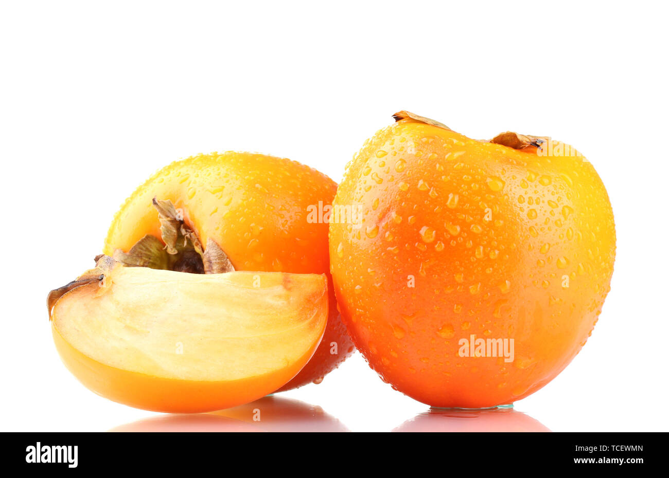 Appetizing persimmons with droplets isolated on white Stock Photo