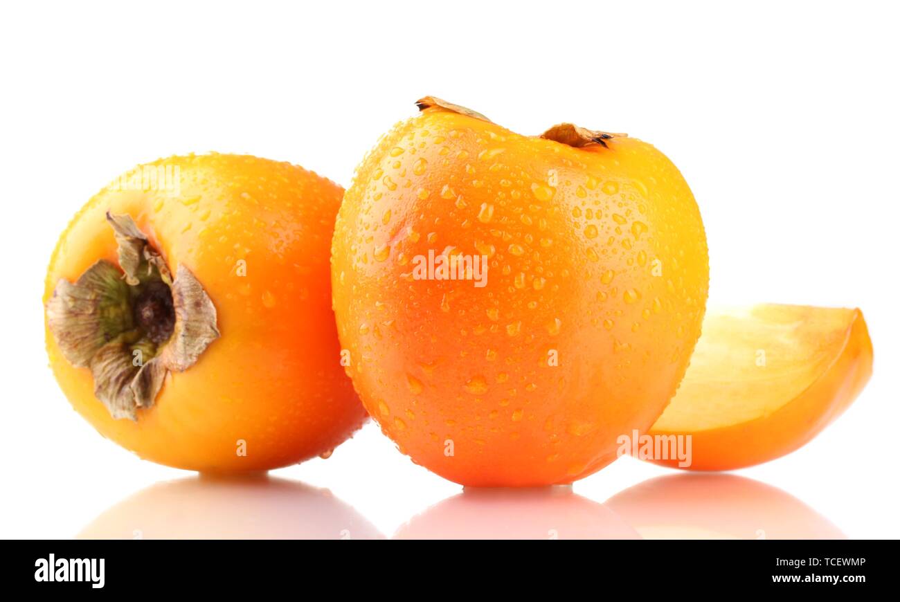 Appetizing persimmons with droplets isolated on white Stock Photo