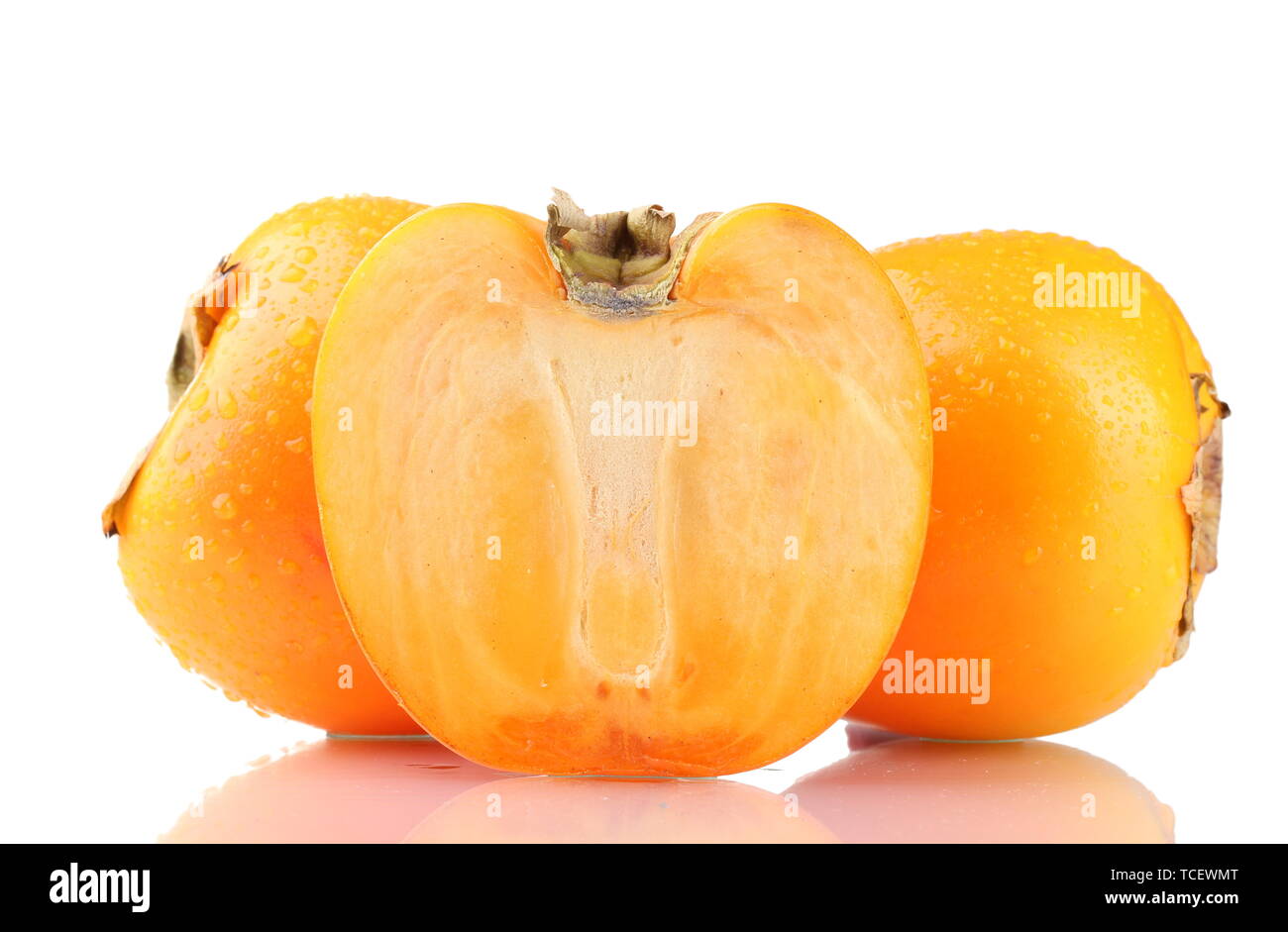 Appetizing persimmons with droplets isolated on white Stock Photo