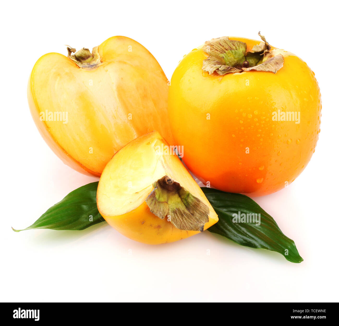 Appetizing persimmons with droplets isolated on white Stock Photo