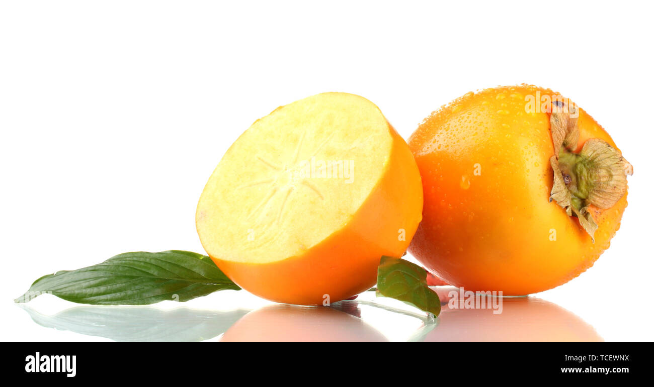 Appetizing persimmons with droplets and leaf isolated on white Stock Photo