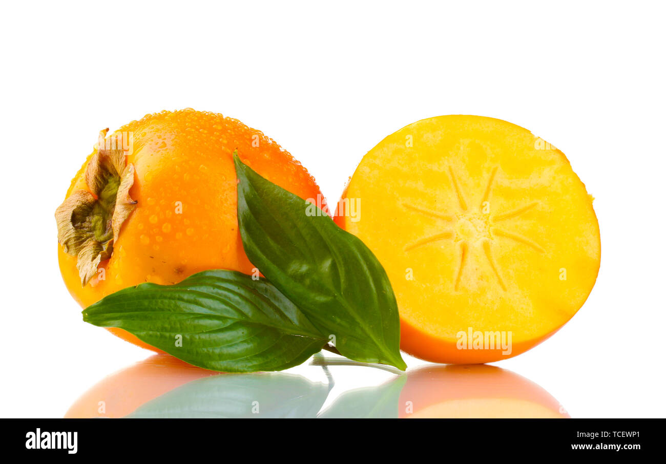 Appetizing persimmons with droplets and leaf isolated on white Stock Photo