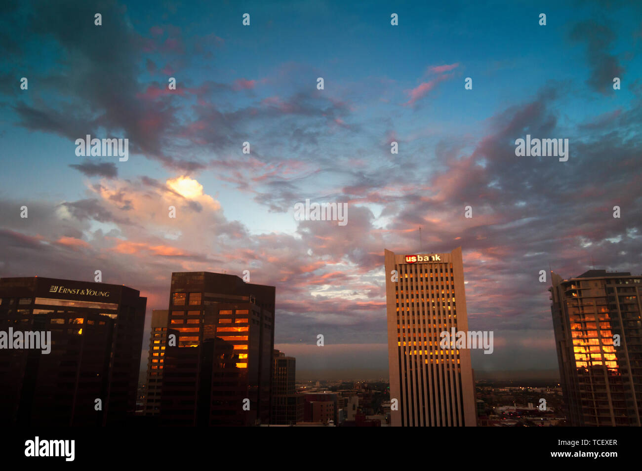Phoenix, ARIZONA - October 21 2017: Skyscrapers in central Phoenix in red sunrise light. View from the 22nd floor. Stock Photo