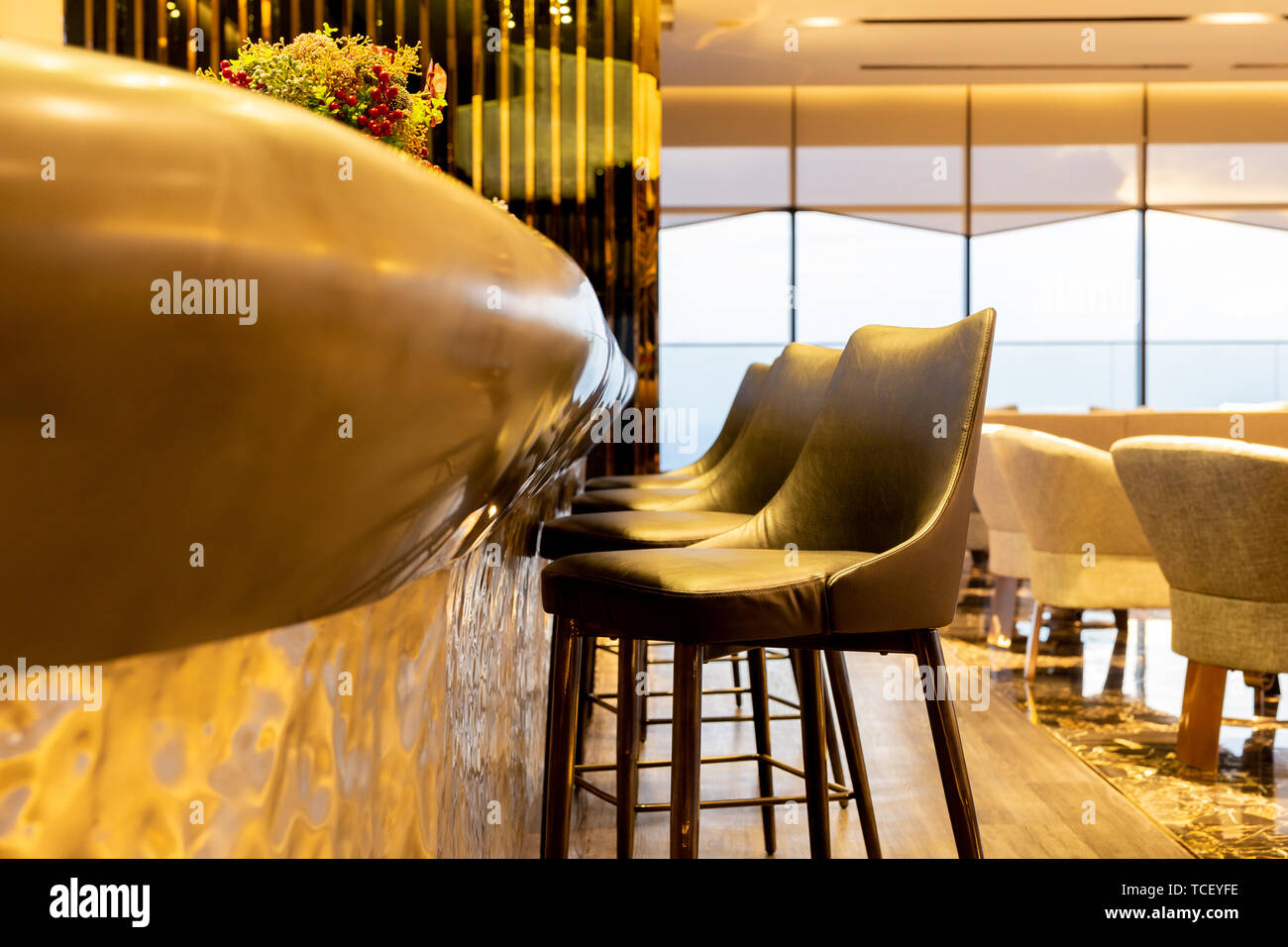 Interior design row of modern leather stools chair in luxury lounge