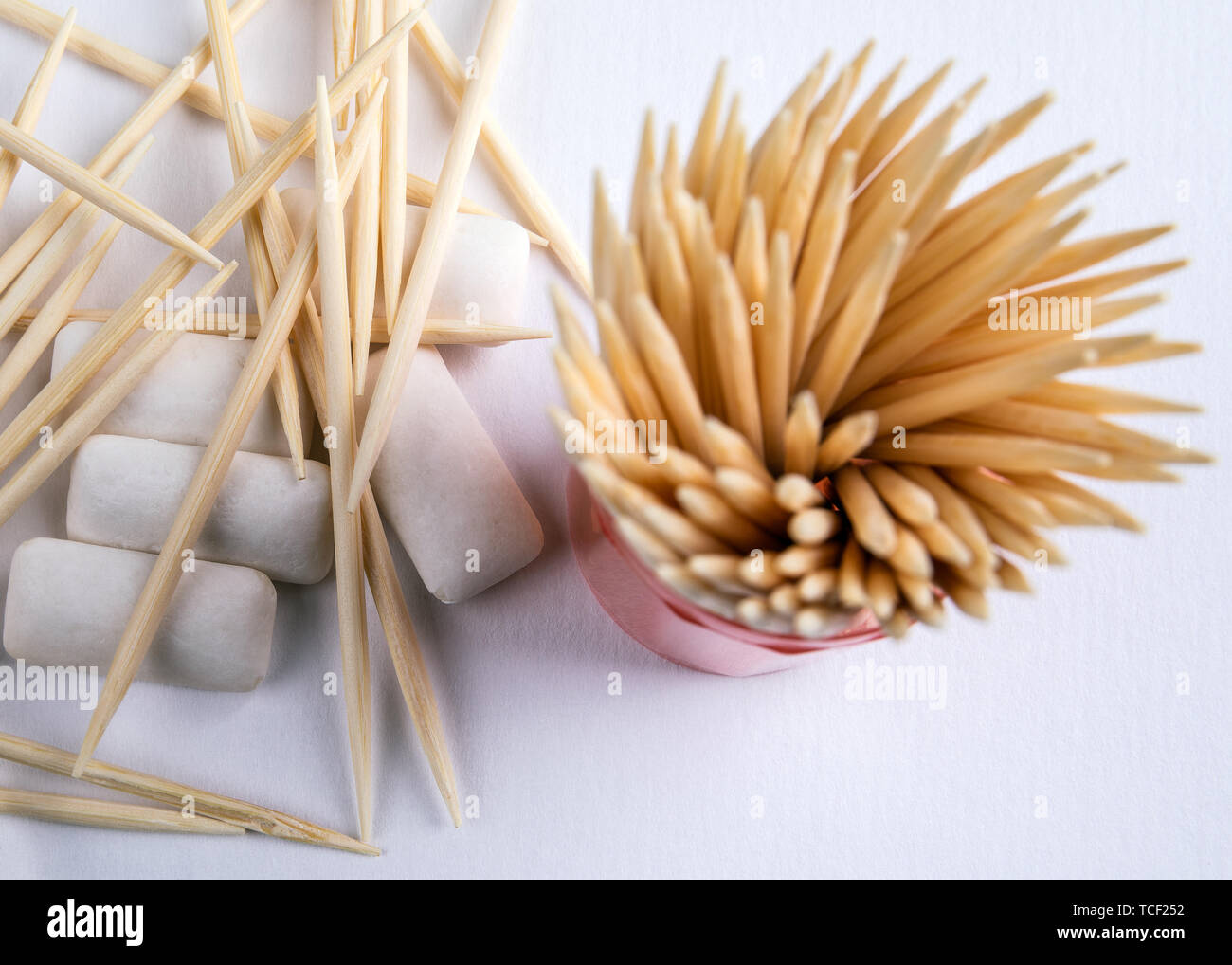 Toothpicks and chewing gum on white background Stock Photo Alamy