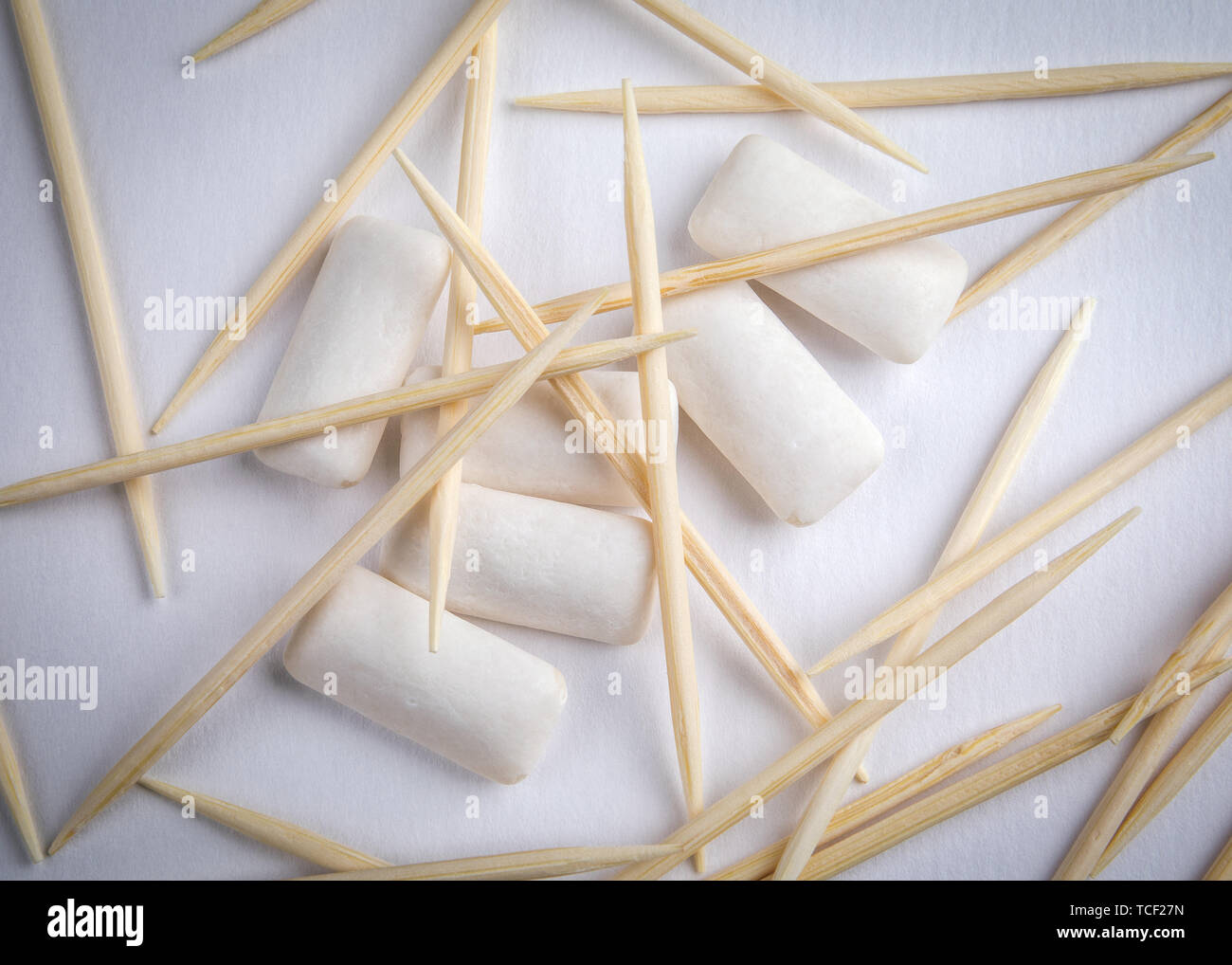 Toothpicks and chewing gum on white background Stock Photo Alamy