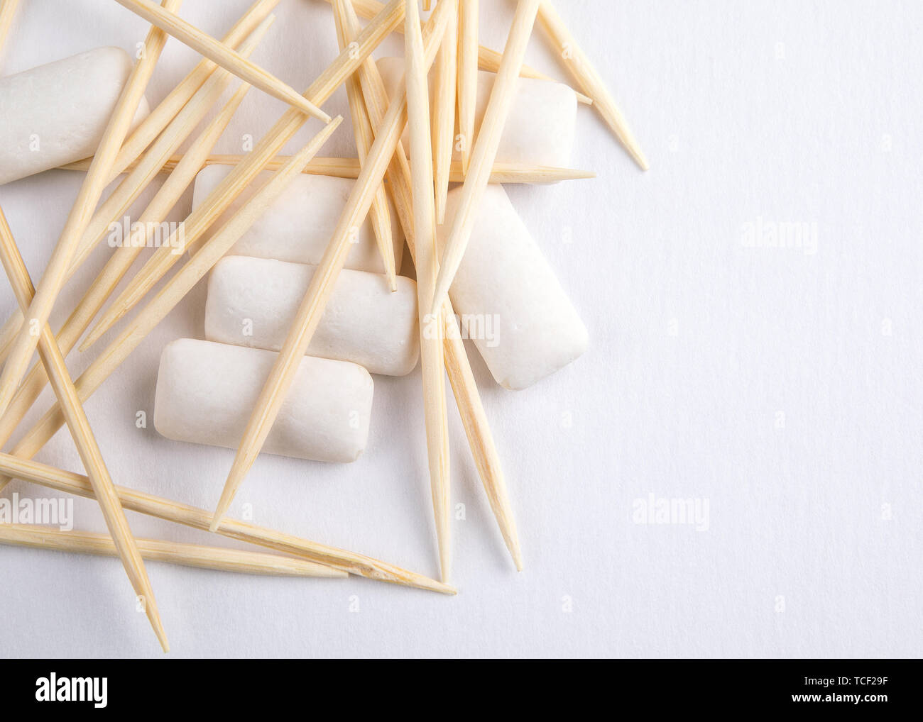 Toothpicks and chewing gum on white background Stock Photo Alamy