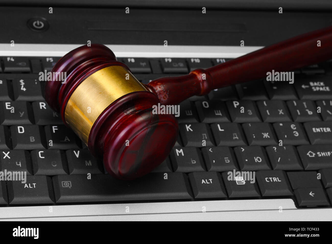 wooden gavel on laptop computer close up Stock Photo - Alamy
