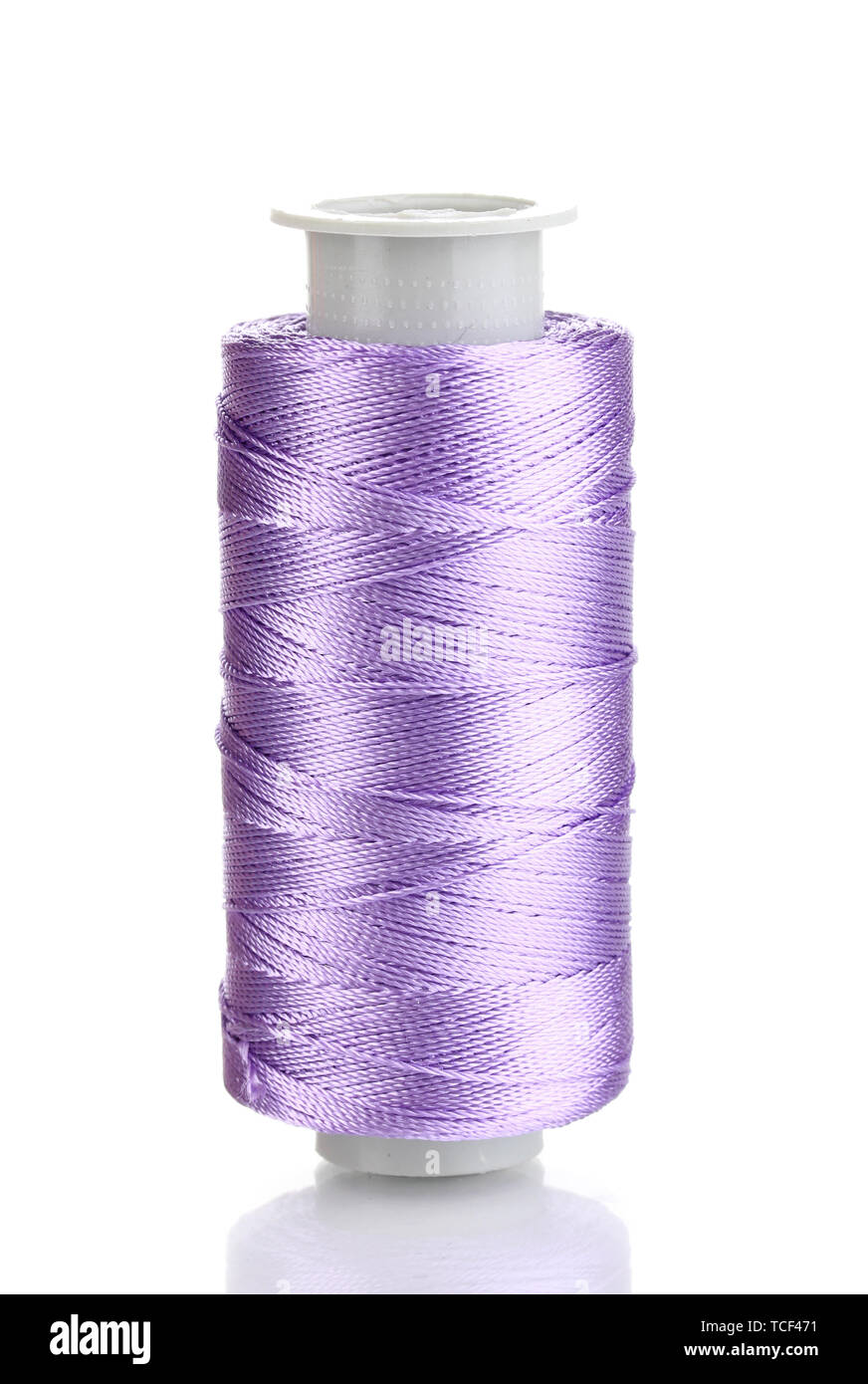 Violet bobbin thread isolated on white Stock Photo - Alamy