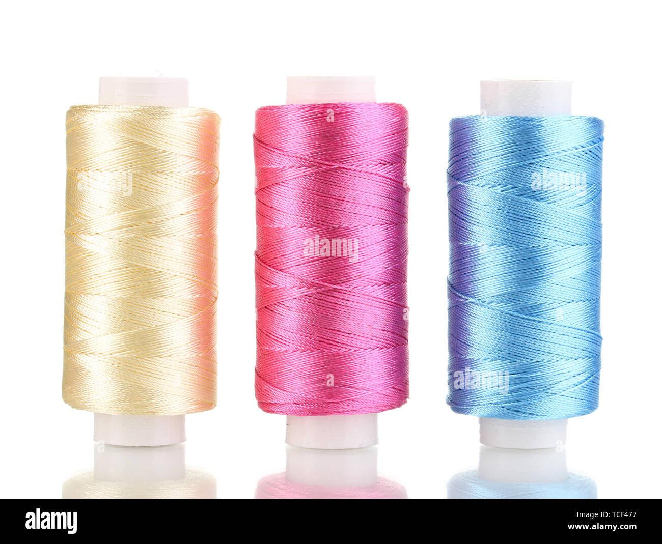 Three bobbin thread isolated on white Stock Photo - Alamy