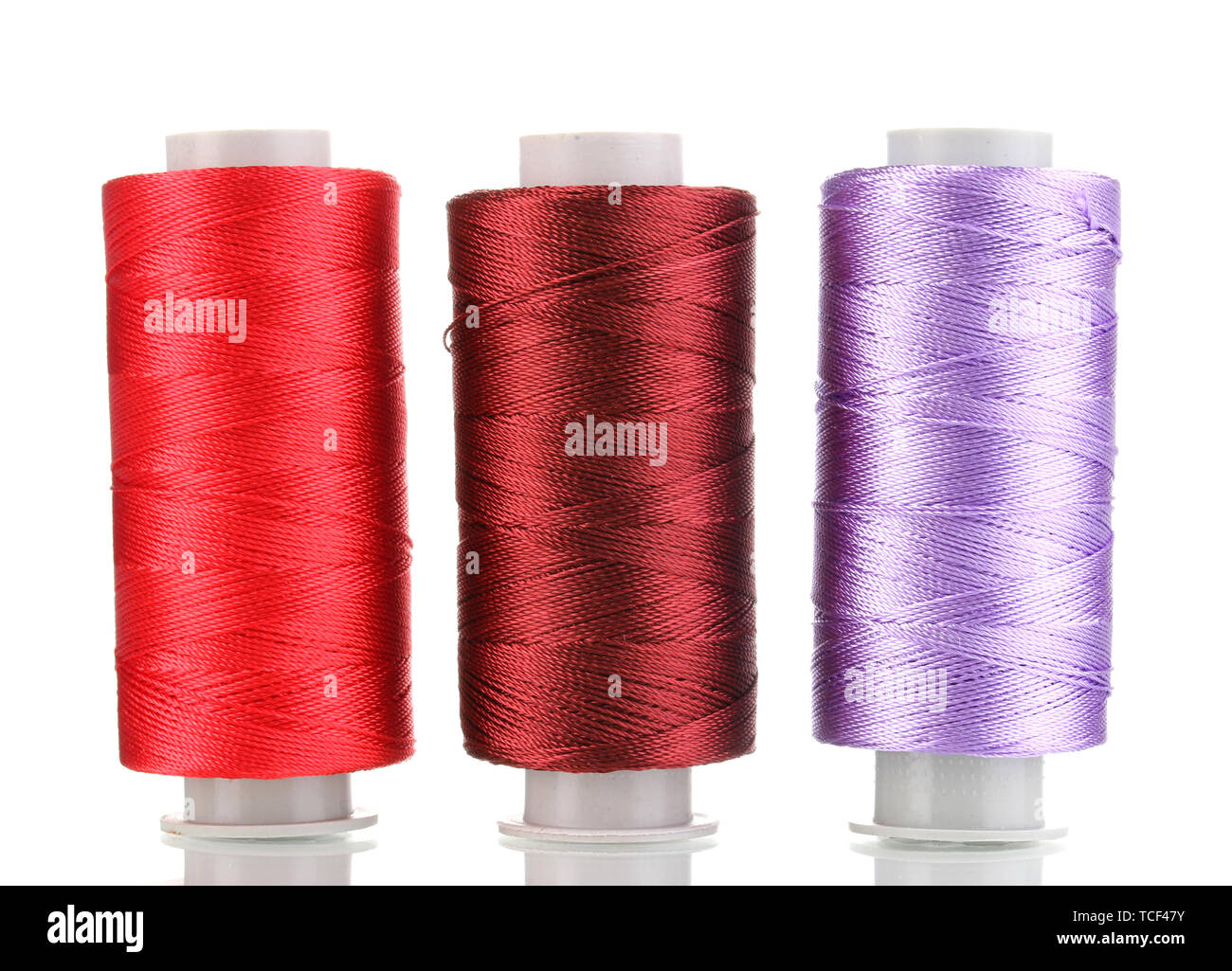 Three bobbin thread isolated on white Stock Photo - Alamy