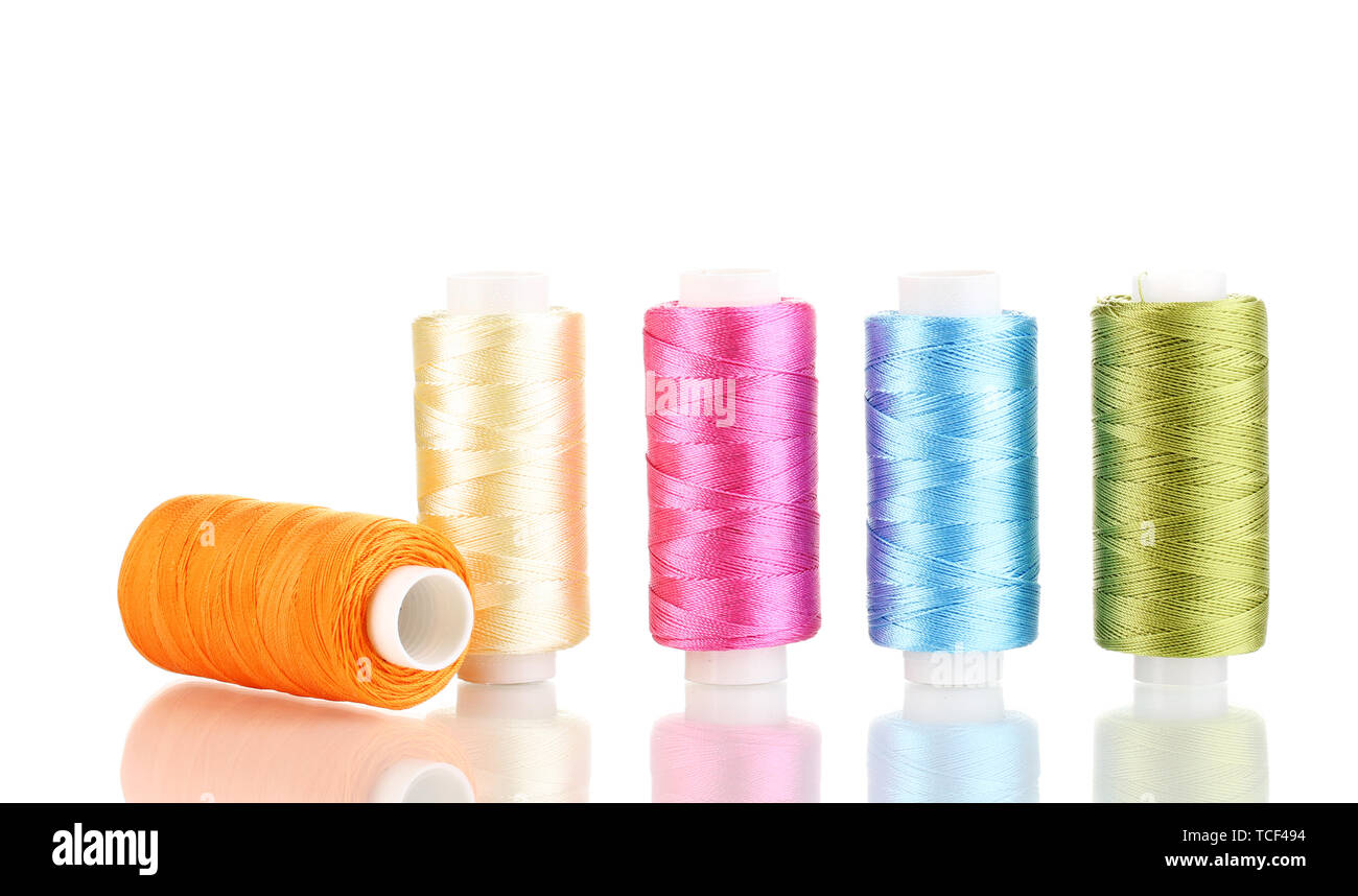 Many spools of thread isolated on white Stock Photo - Alamy
