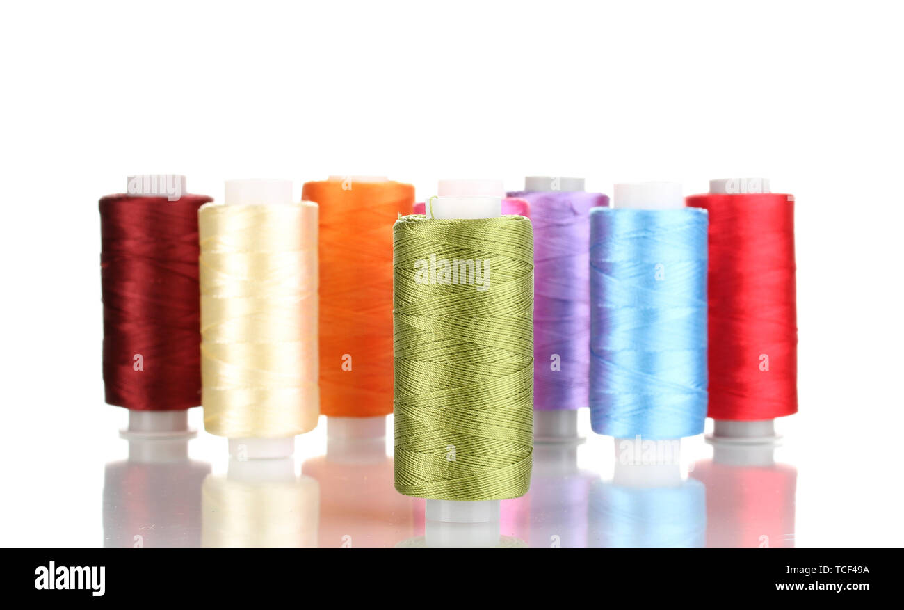 Many spools of thread isolated on white Stock Photo - Alamy