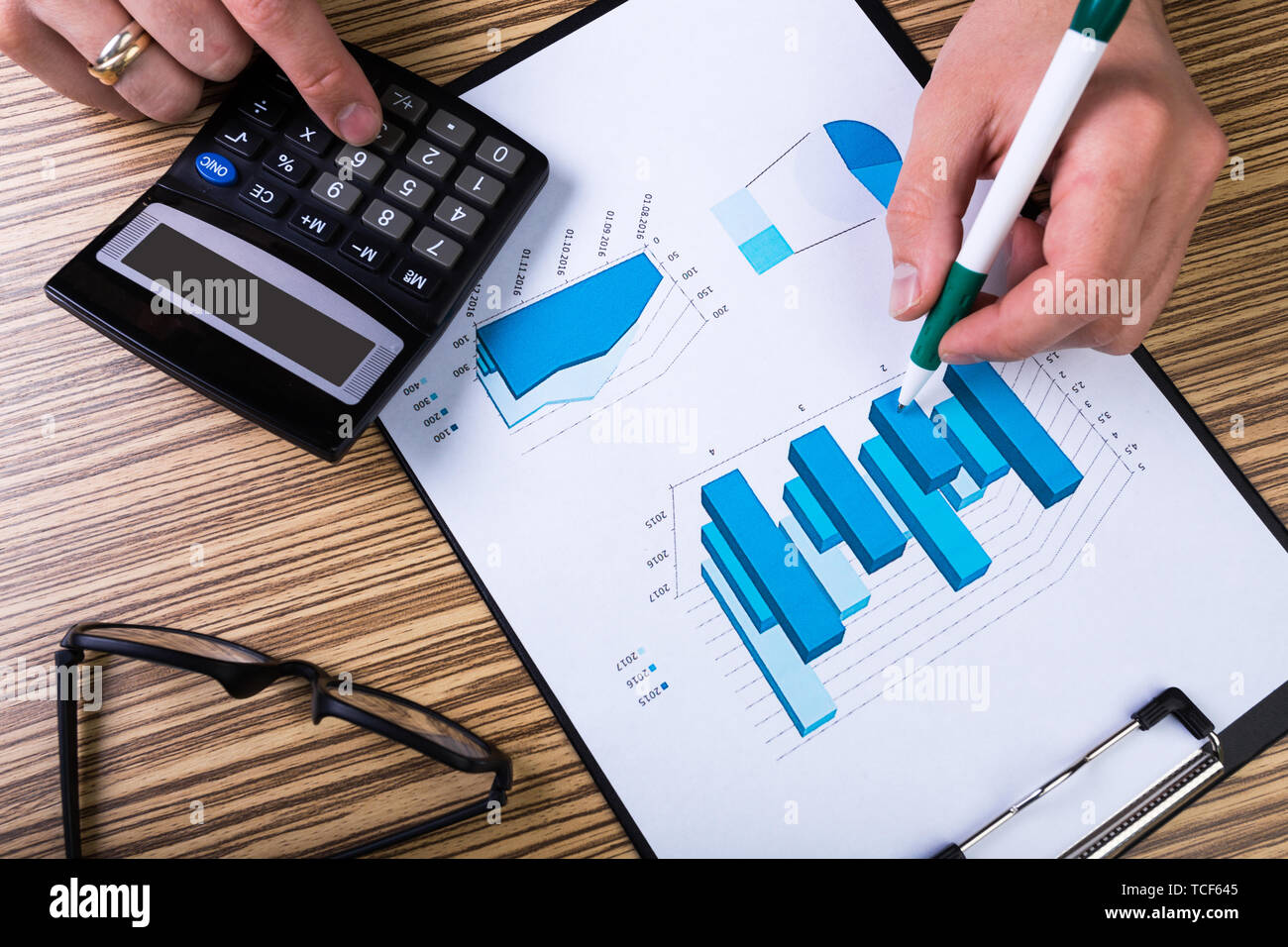 Graphs and Calculator Stock Photo Alamy