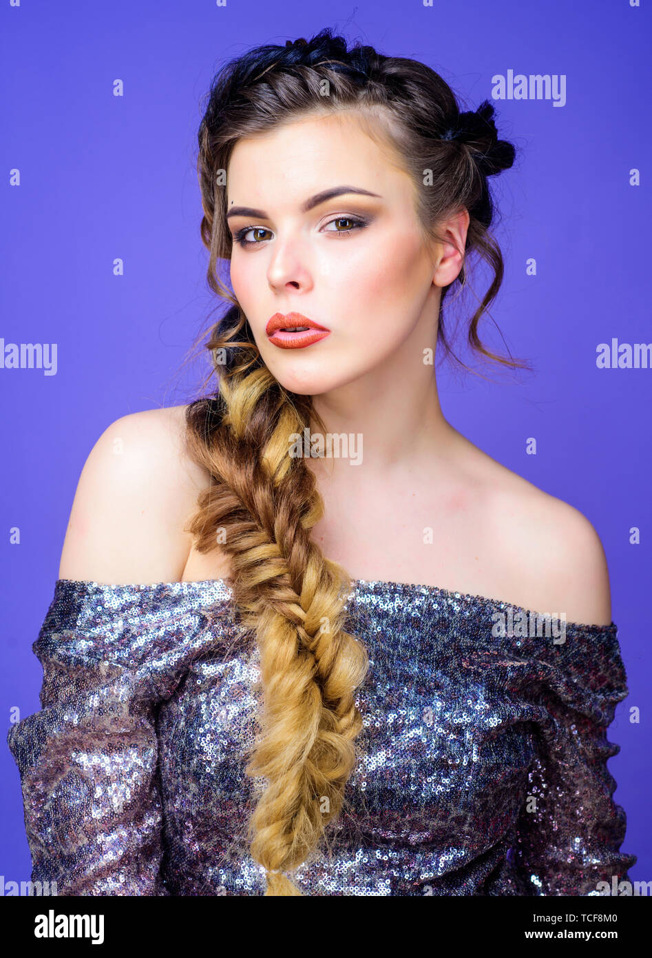 Braided hairstyle. French braid. Professional hair care and creating