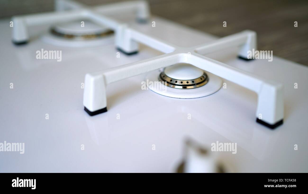 White modern gas stove. Macro closeup of modern luxury gas stove top