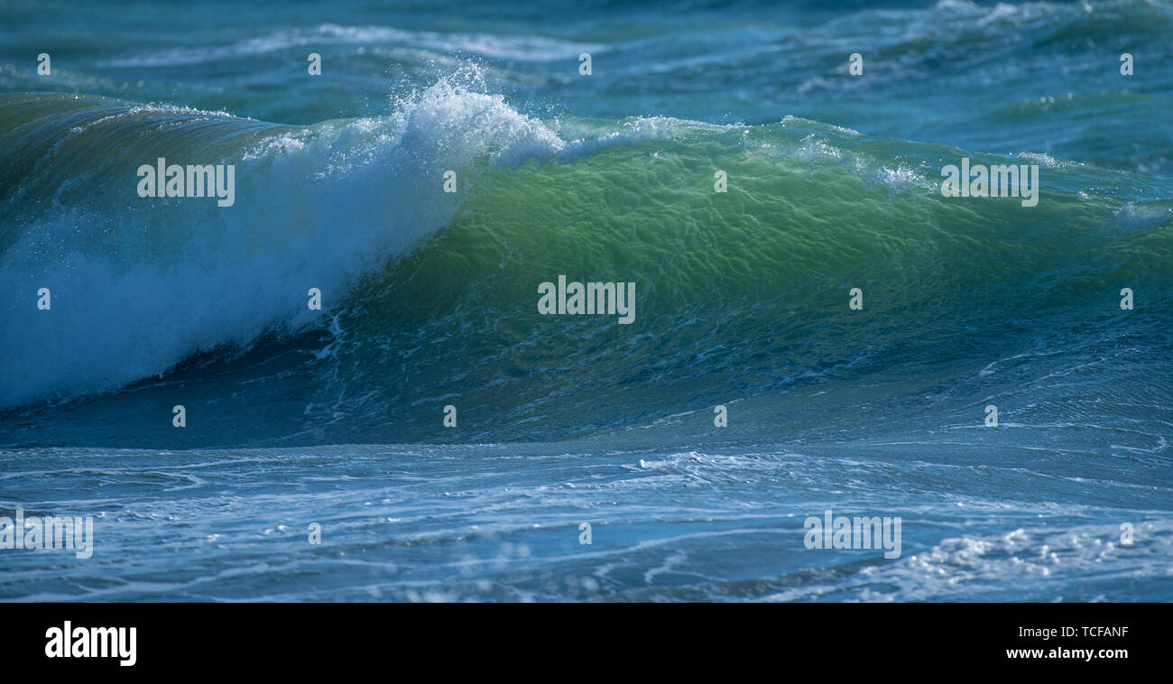 Water ocean wave curling breaking Stock Photo