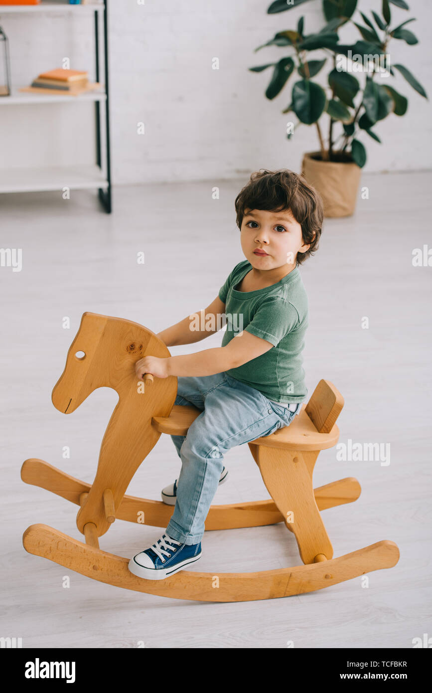 child on rocking horse