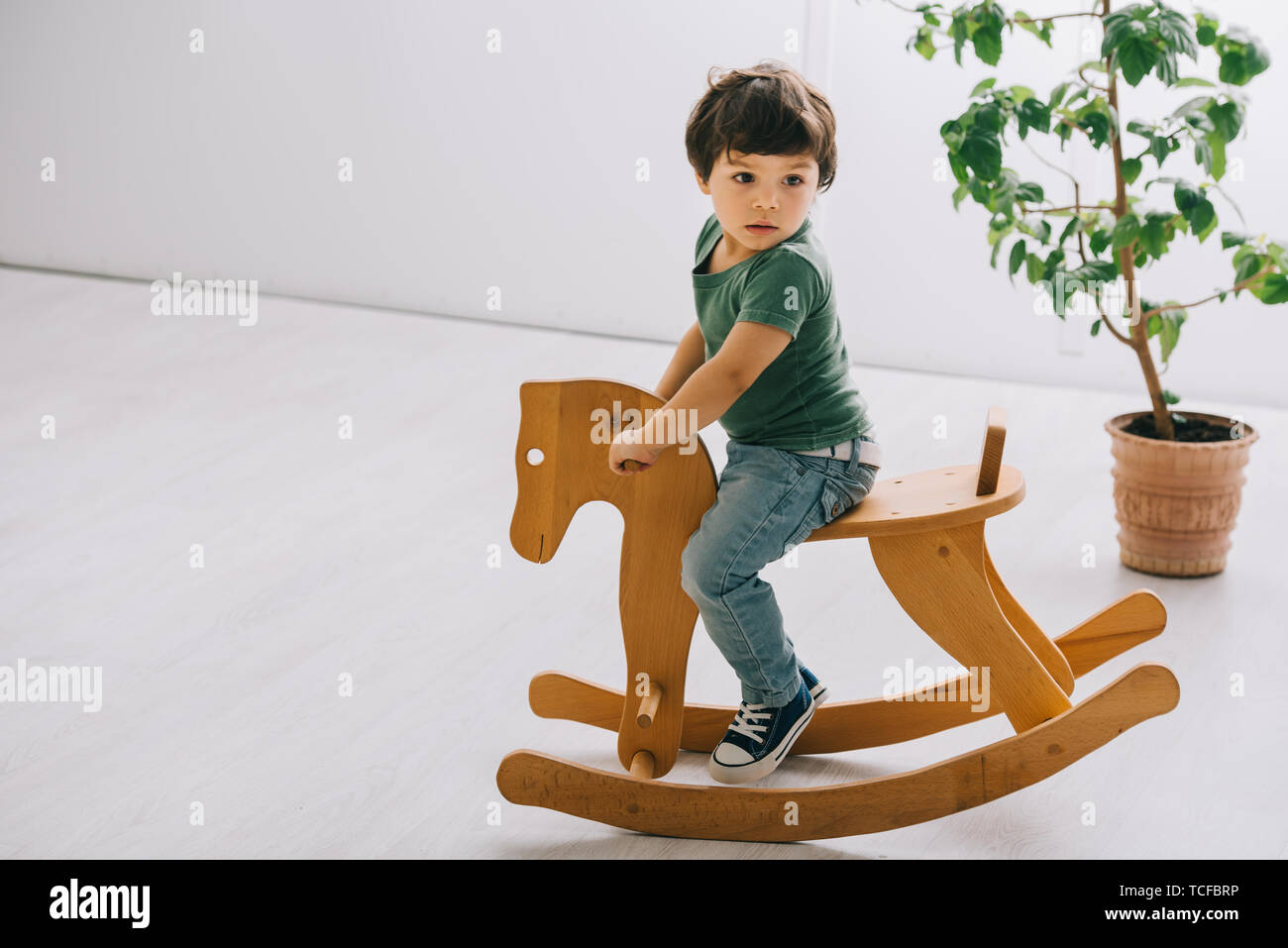child on rocking horse