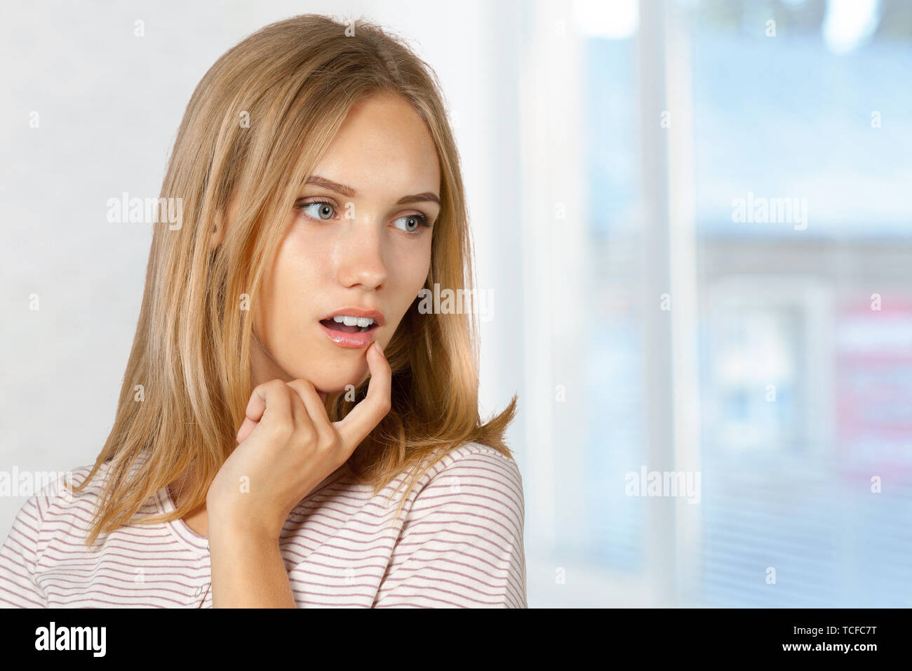 picture of teenage girl with finger on lips Stock Photo - Alamy
