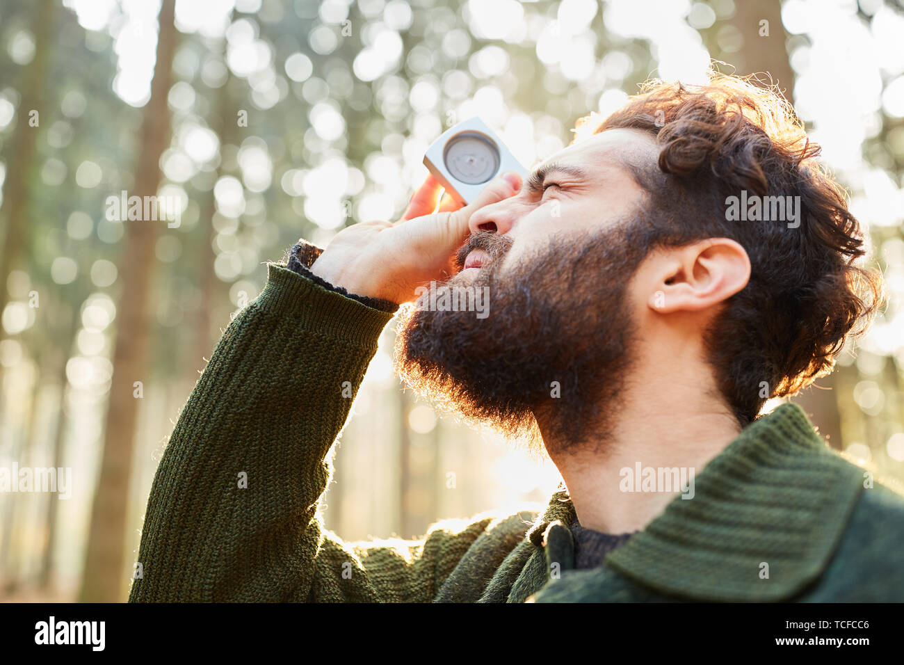 Forester determines tree height by threepoint measurement with