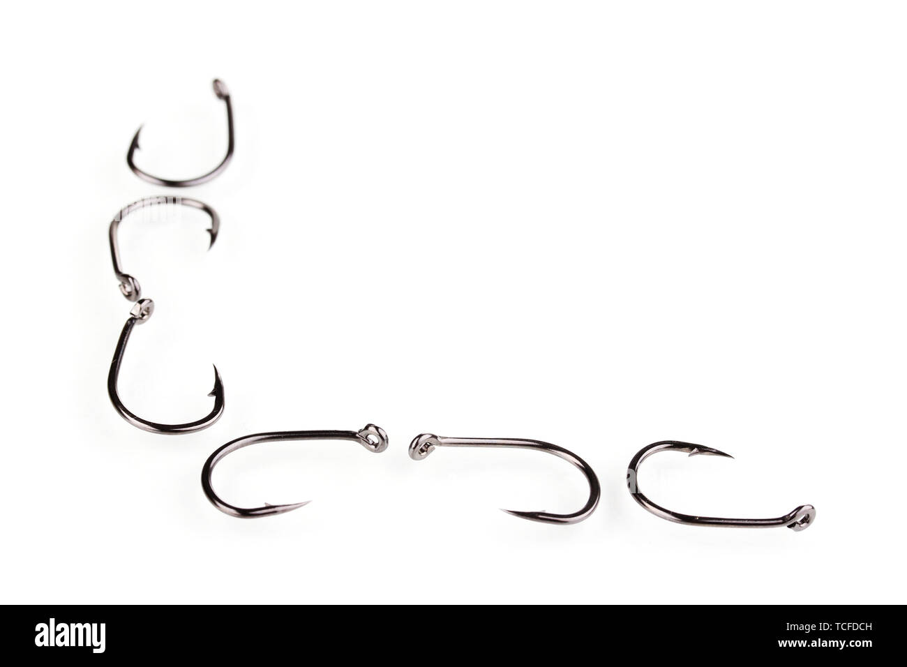Fish hooks isolated on white Stock Photo Alamy