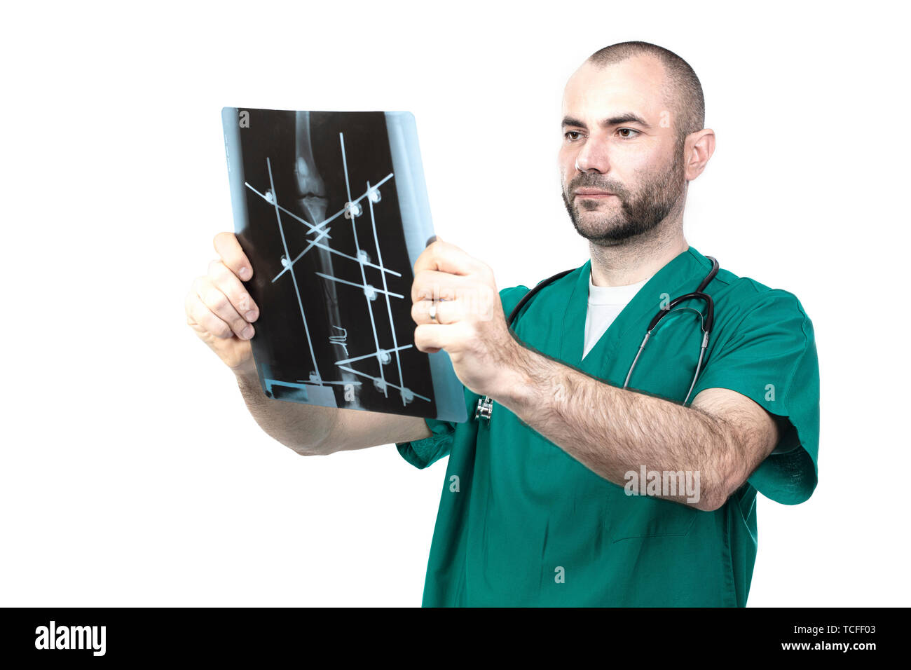 Veteran at work examines an xray of a multiple dog fracture. Stock Photo